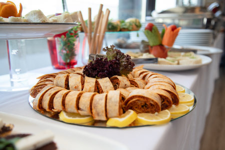 catering wedding buffet food indoor in luxury restaurant with meat colorful fruits and vegetablesの素材