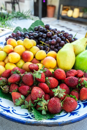 Assortment of fresh fruits on the table. Healthy food concept.の素材
