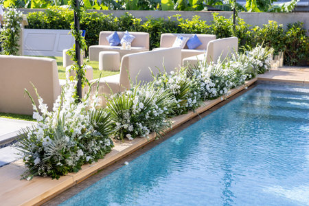 Wedding decorations at a swimming pool in a luxury villaの写真素材