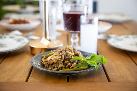 Traditional Turkish and Greek dinner appetizer served on a wooden table.の写真素材