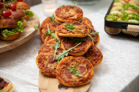 Mini pizzas with mozzarella cheese and arugula.の写真素材