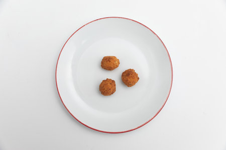 Fried chicken nuggets on a plate isolated on white background.の写真素材