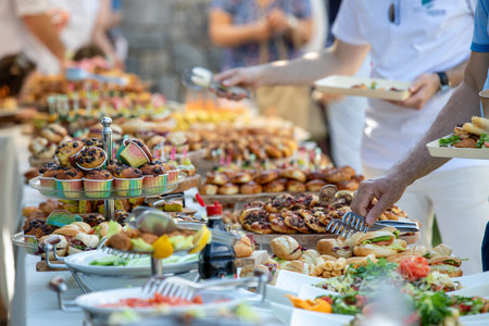 catering wedding buffet with variety of food snacks and appetizersの写真素材