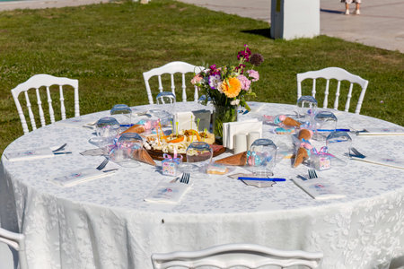 Table setting for wedding or another catered event dinner in the parkの写真素材
