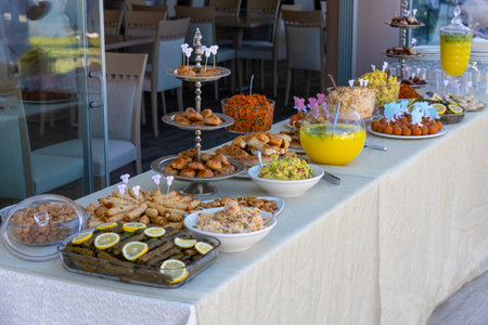 catering buffet with variety of food snacks and appetizers in restaurantの写真素材