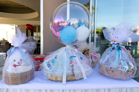 Colorful balloons in a basket on the table at a birthday partyの写真素材
