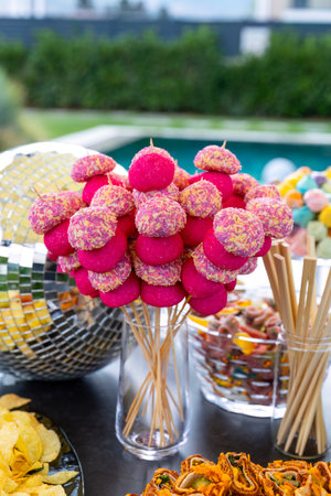 Colorful candies in the shape of hearts on a stick.の写真素材