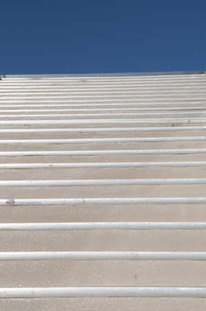 Cement stairs taking from low angle to look like they are leading to the skyの写真素材