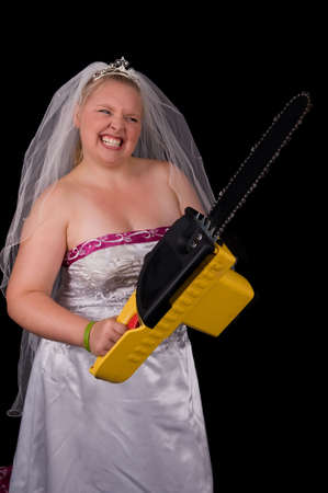 Angry Bride (Bridezilla) using a chainsaw to attack the people bothering herの写真素材
