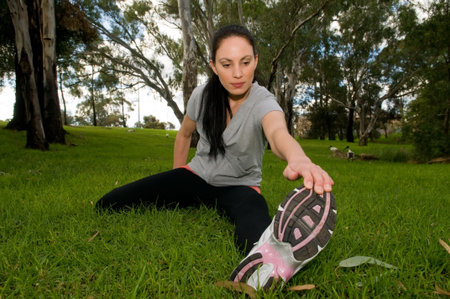 Young woman performing stretching exercises.