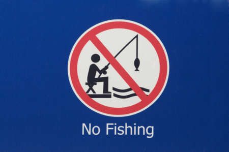No fishing sign warning people fishing is not permitted in this areaの写真素材
