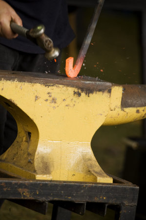Close up of horseshoe making