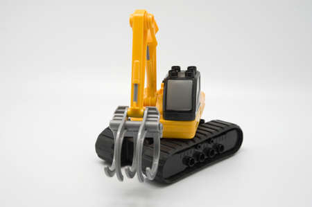 Toy excavator on a neutral backgroundの写真素材