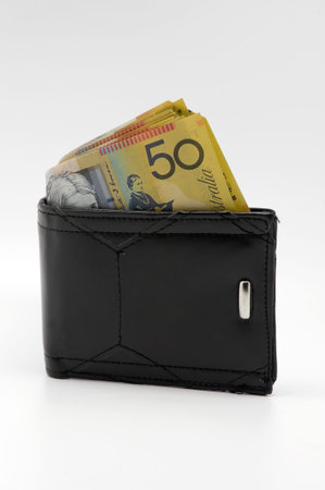 Australian fifty dollar notes in a mens wallet