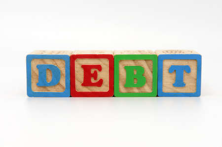 Wooden Alphabet blocks spelling the word debtの写真素材