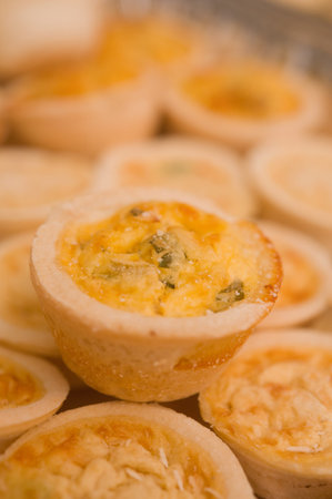 Mini Quiches on a platter ready to serve.