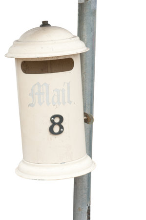 Number 8 on an isolated cream letterbox