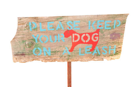 Wooden sign advising to keep dogs on a leashの写真素材