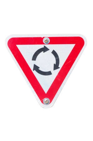 A roundabout road sign isolated on a white backgroundの写真素材