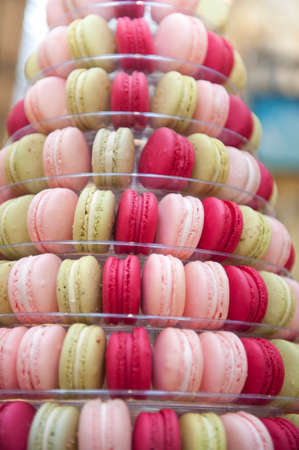 A selection of Macaroons stacked at a stall at a public marketの写真素材