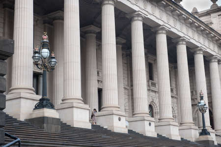 Melbourne, Australia - August 29, 2014: The steps and columns outside the entrance to the Victorian Parliament Building. The business of governing the state of Victoria is undertaken within this building. The steps and columns are a popular spot for weddiのeditorial素材