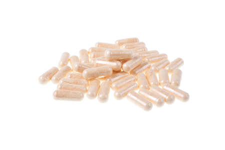 A pile of Garlic Extract Capsules isolated on a white backgroundの写真素材