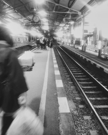 Train station in black and white. Blurred image of train station.の写真素材