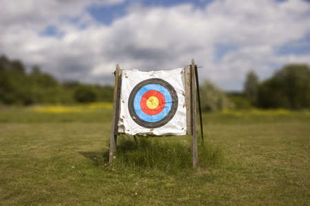 A single archery target against a cloudy sky.の写真素材