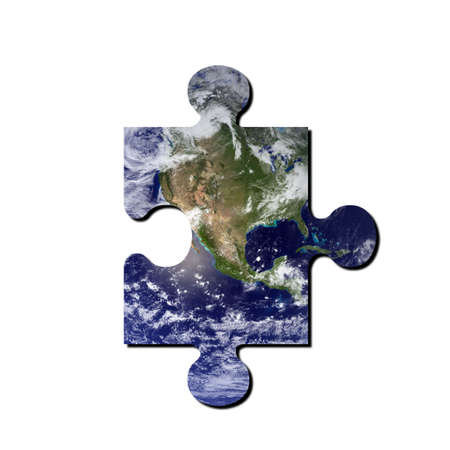 A picture of the earth with jigsaw cut out. Earth picture from NASA.の写真素材