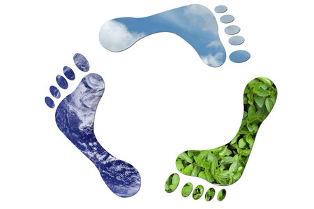 A recycle sign made up of three feet made up of green leaves, water and sky.