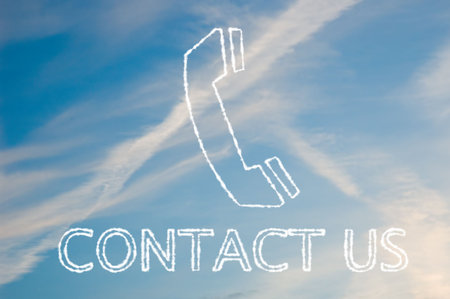 The letters contact us written with cloud letters underneath a telephone symbol