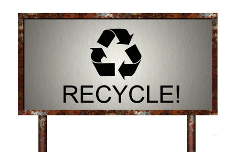 A rusty billboard with a recycle symbol and the text recycle!の写真素材