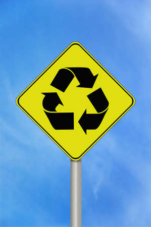 A black and yellow recycle sign with the recycling symbolの写真素材