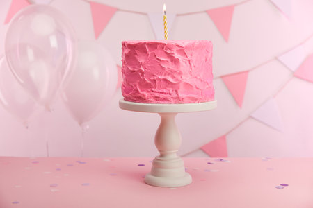 tasty pink birthday cake burningの写真素材