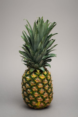 whole ripe fresh pineapple grey