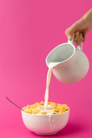cropped shot hand holding jug