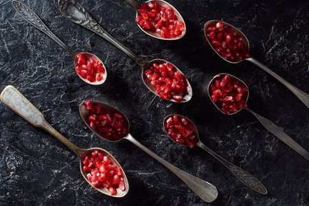 flat lay metal spoons garnetの写真素材