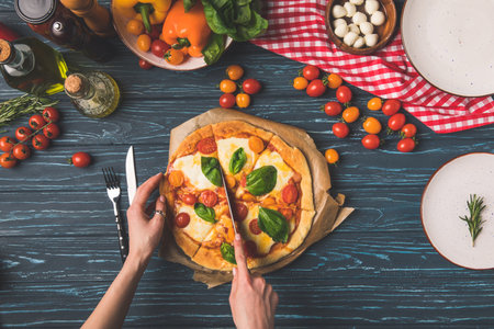 cropped image woman cutting homemadeの写真素材