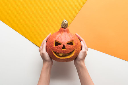 cropped view woman holding halloweenの写真素材