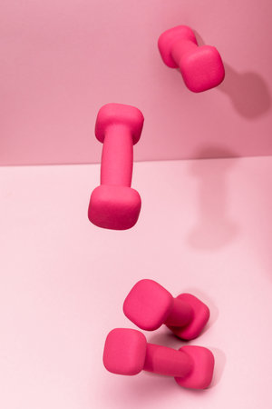 pink bright dumbbells flying airの写真素材