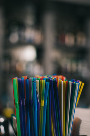 colored plastic straws drinking blurred