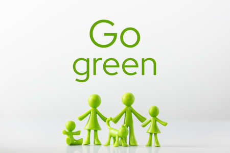 Green figures made of biodegradable plastic symbolic model of family with children Minimal ecology concept. Go Green.の写真素材