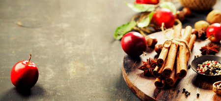 Spices and apples on rustic table, horizontal compositionの写真素材