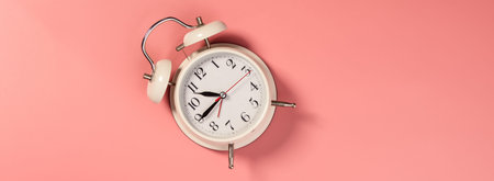 White alarm clock on pink background - pattern