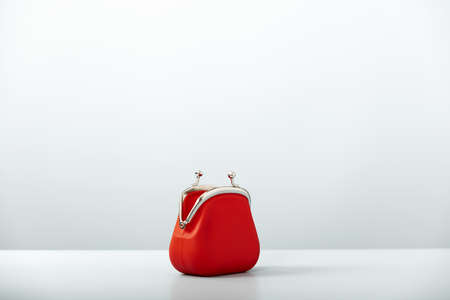 Open Red Coin Purse on blue background with copy spaceの写真素材