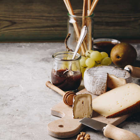 White wine with charcuterie assortment on the stone backgroundの写真素材