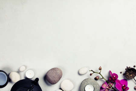 Asian tea set and spa stones on concrete backgroundの写真素材