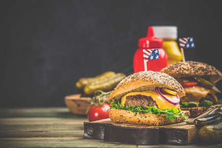 Homemade hamburgers on wooden background, space for textの写真素材