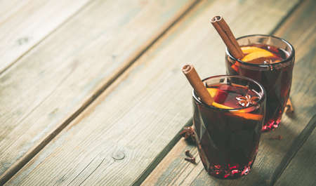 Mulled wine with spices and orange slicesの写真素材