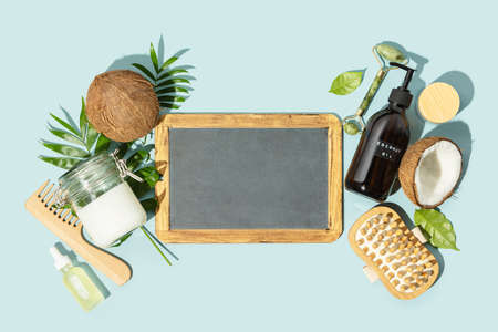 Spa coconut products flat lay with chalkboard, face, body and hair organic treatment conceptの写真素材